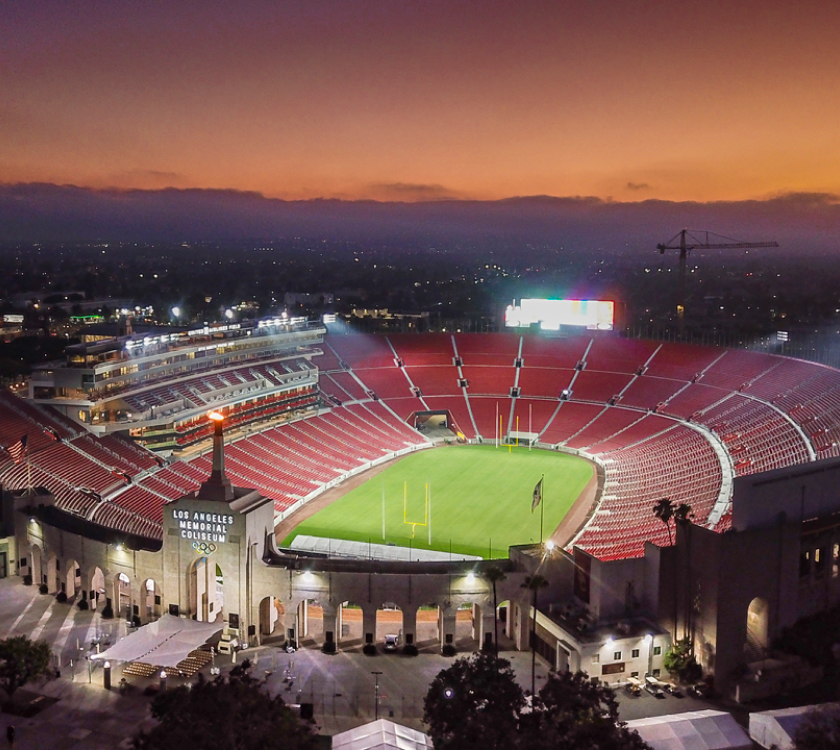 full stadium view with sunset in sky