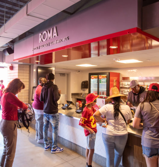 people waiting in line for food